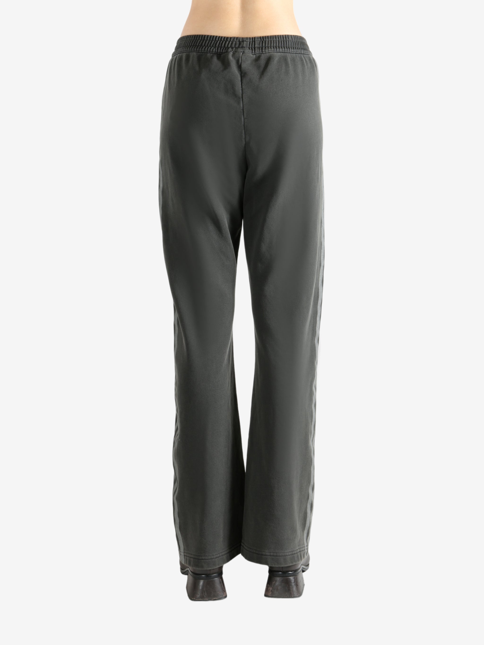 Grey pants worn by a person, showing the pants' fit