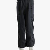 Black pants worn by a person, showing the pants fit