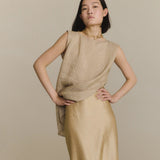 Tan top worn by a person, showing the top fit