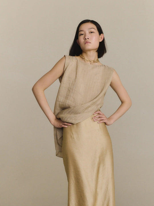 Tan top worn by a person, showing the top fit