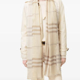 Tan scarf worn by a person, showing the scarf fit