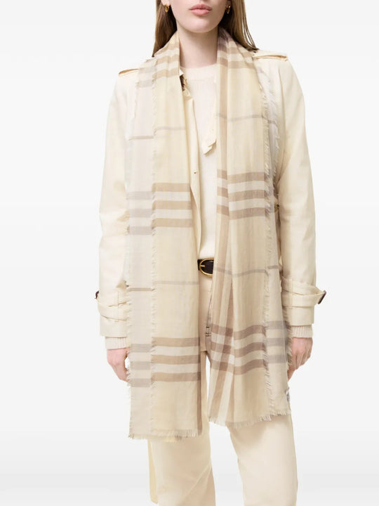 Tan scarf worn by a person, showing the scarf fit