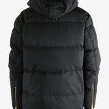 Black jacket worn by a person, showing the jacket's fit