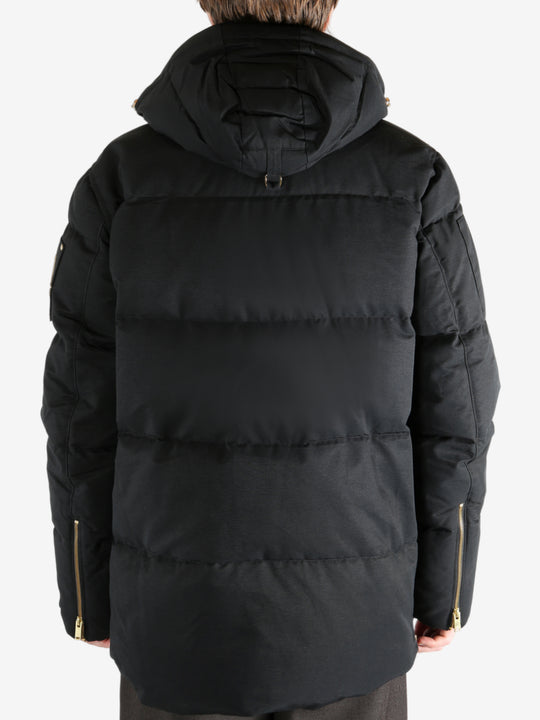 Black jacket worn by a person, showing the jacket's fit