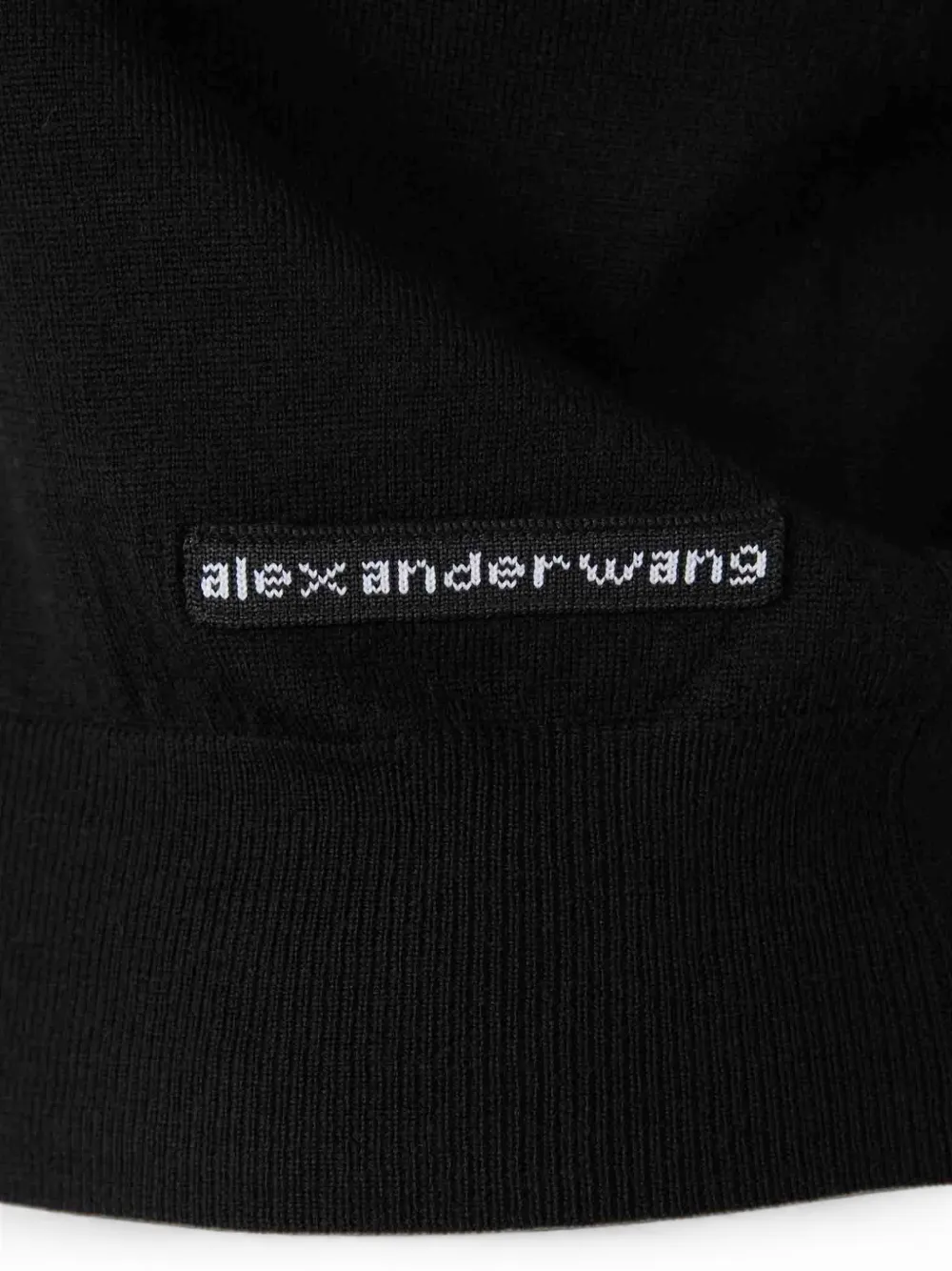 Close up of Black top, showing texture of the 100% wool fabric