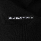 Close up of Black top, showing texture of the 100% wool fabric
