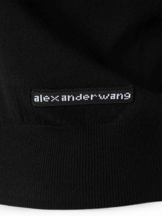 Close up of Black top, showing texture of the 100% wool fabric