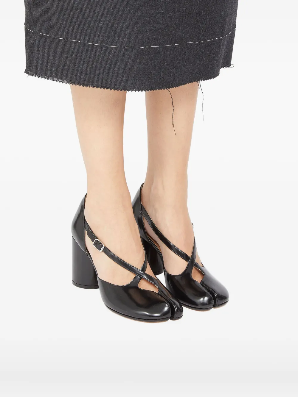 Black heel worn by a person, showing the heel fit