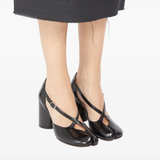 Black heel worn by a person, showing the heel fit