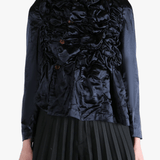 Navy jacket worn by a person, showing the jacket's fit