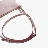 Close up of pink bag, showing texture of the leather fabric