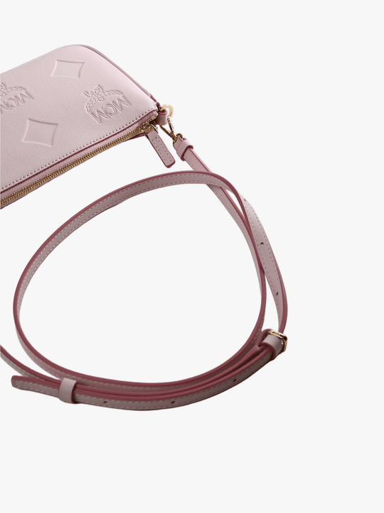 Close up of pink bag, showing texture of the leather fabric