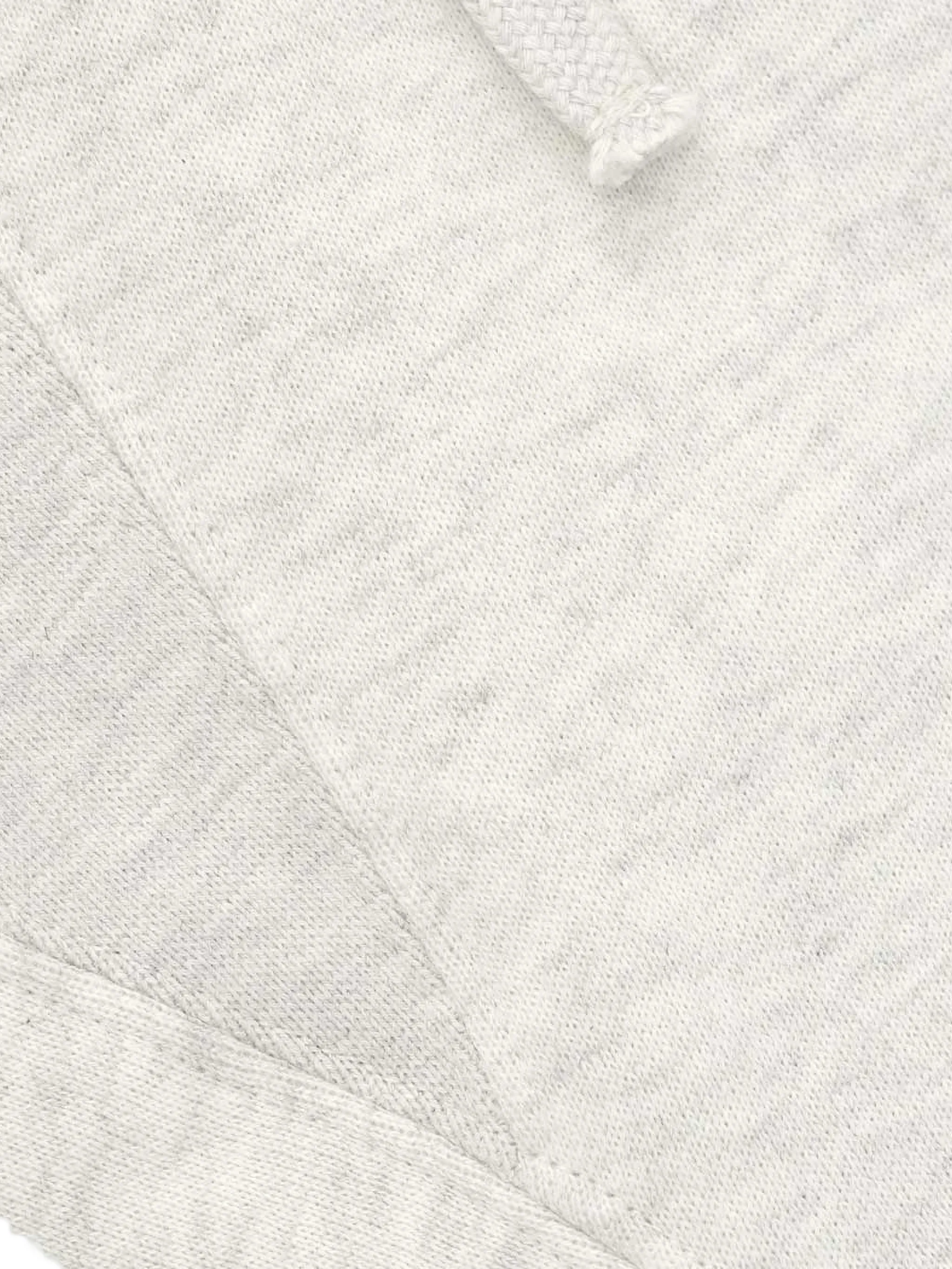 Close up of white shorts, showing texture of the Cotton and Polyester fabric