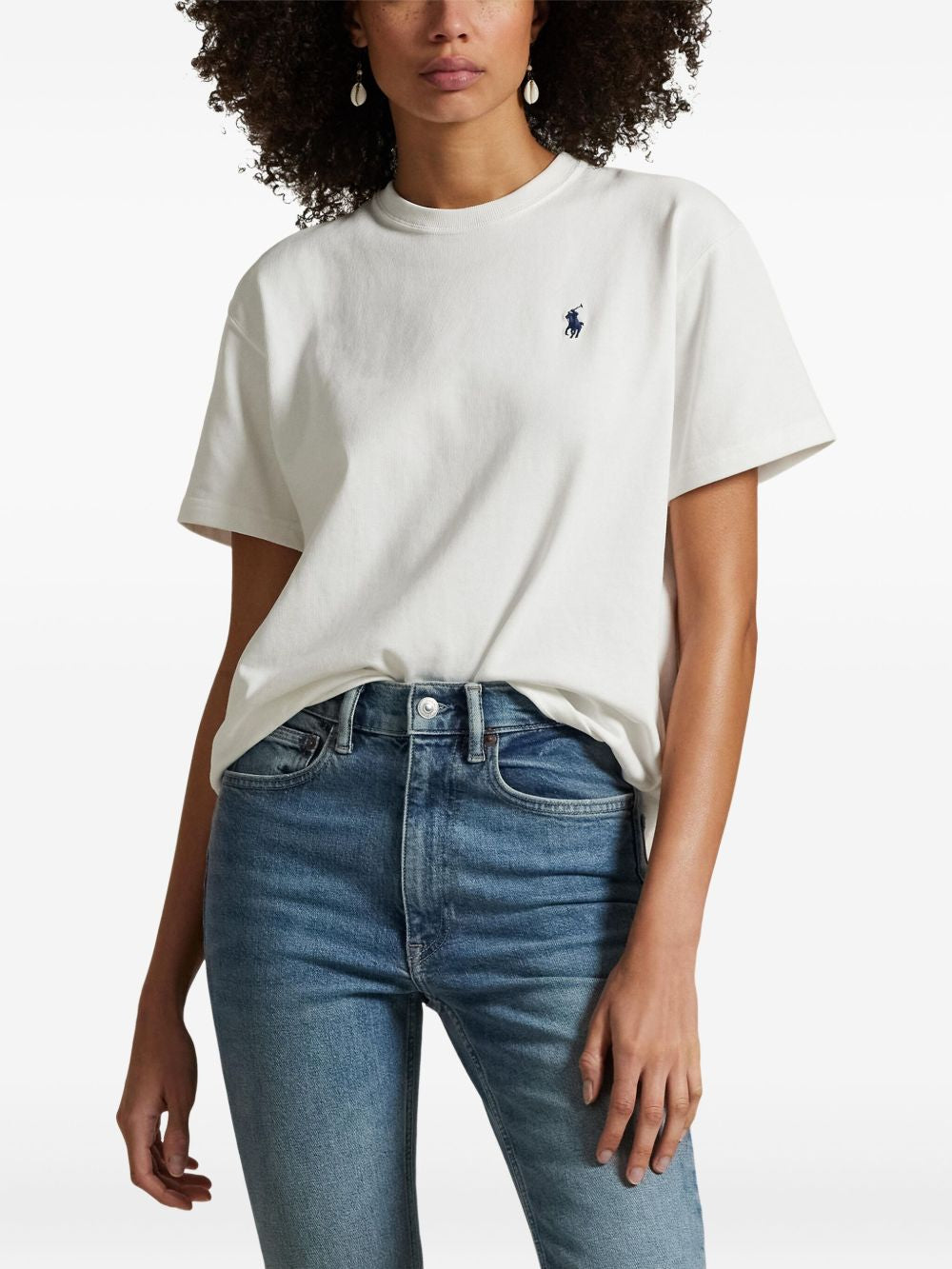 White t-shirt worn by a person, showing the t-shirt fit