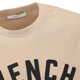 Close up of tan t-shirts, showing texture of the cotton fabric