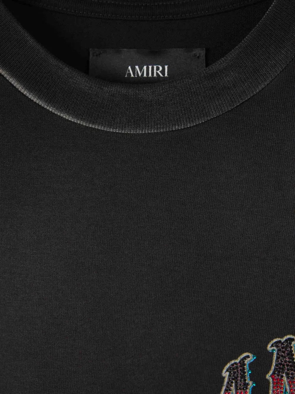 Close up of Black t-shirt, showing texture of the 100% cotton fabric