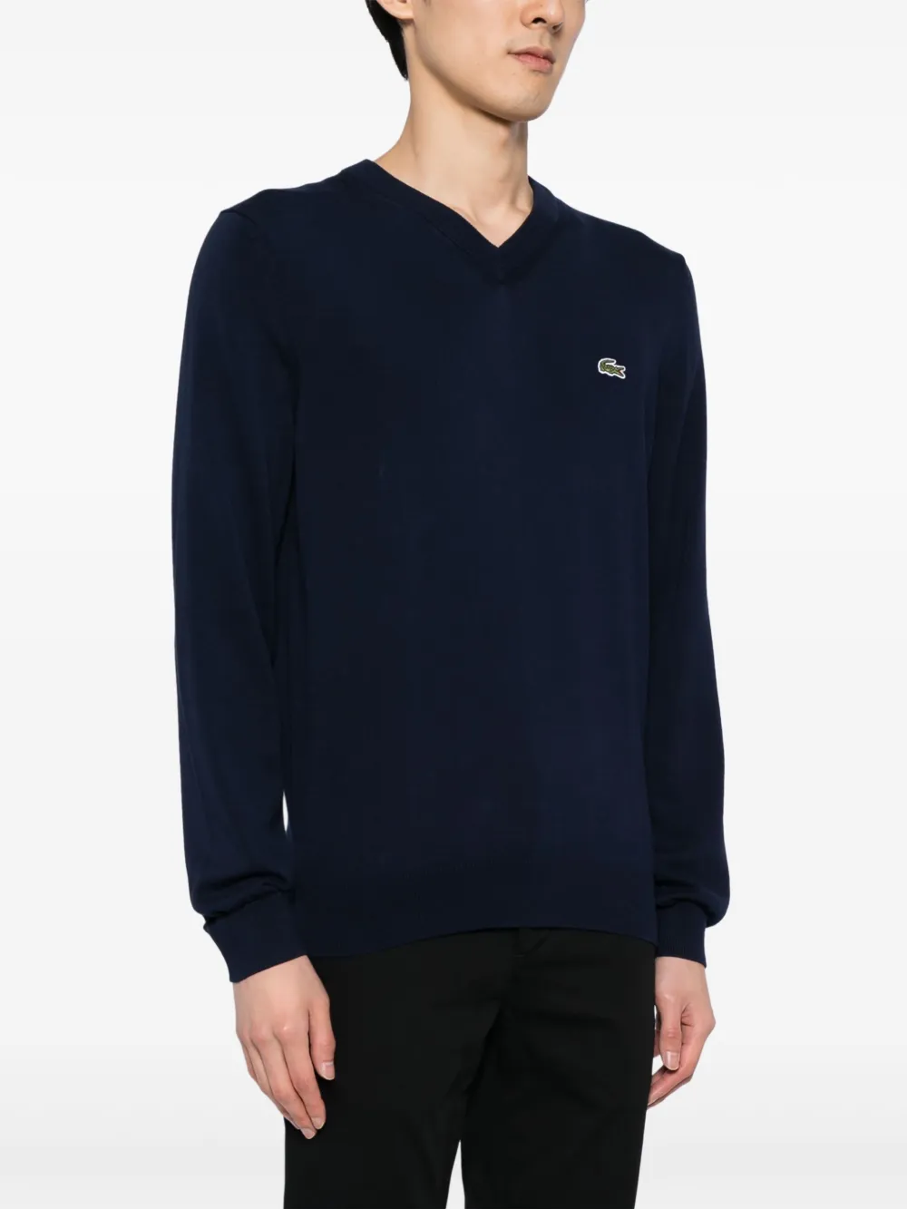 Navy sweater worn by a person, showing the sweater fit
