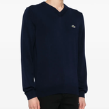 Navy sweater worn by a person, showing the sweater fit
