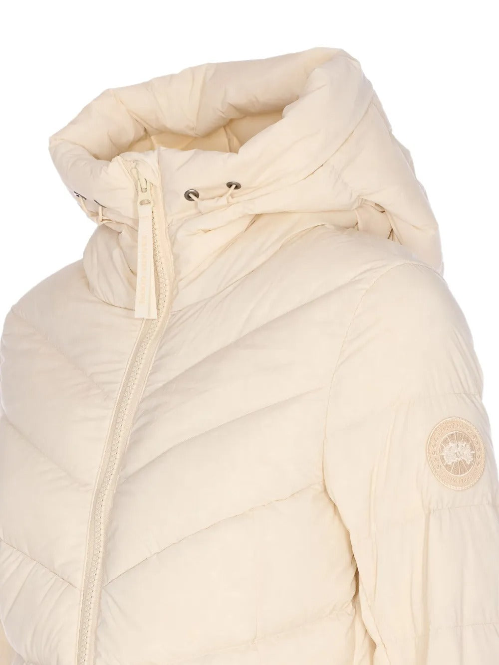 Close up of the tan jacket, showing texture of the nylon fabric