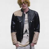 Black jacket worn by a person, showing the jacket fit