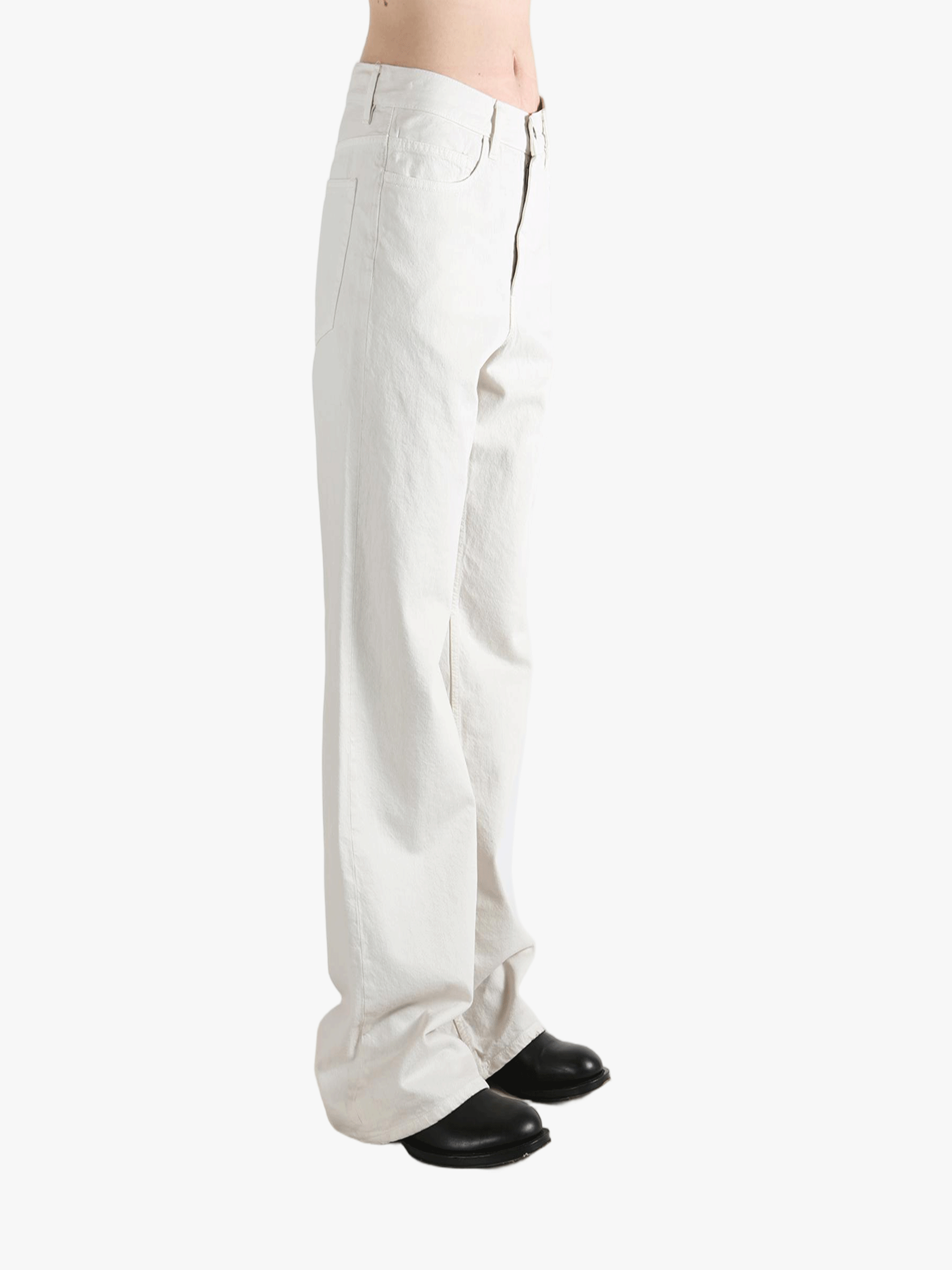 White pant worn by a person, showing the pant's fit