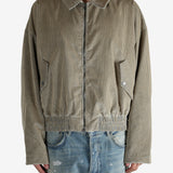 Tan jacket worn by a person, showing the jacket’s fit