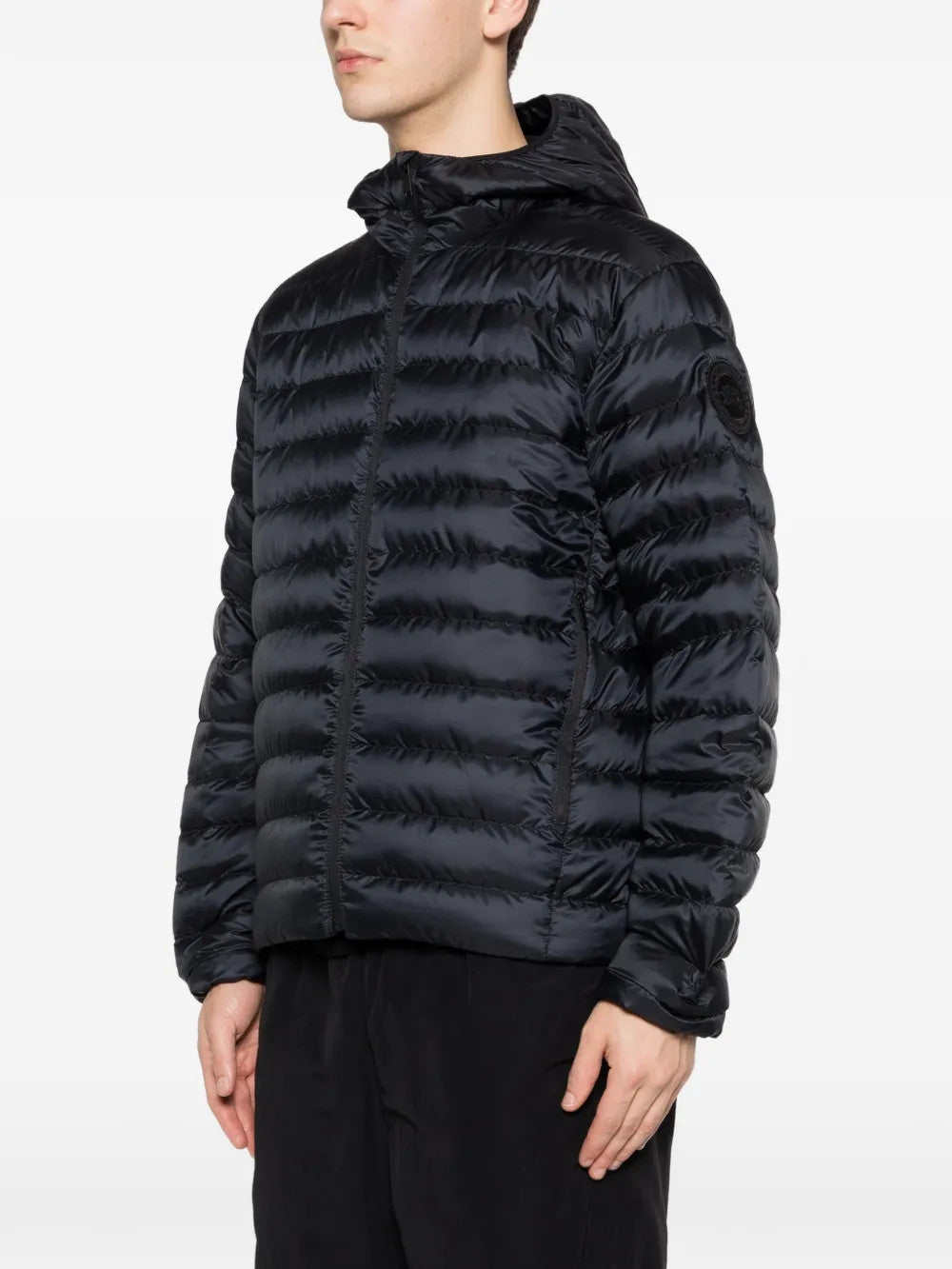 Black hoodie worn by a person, showing the hoodie fit