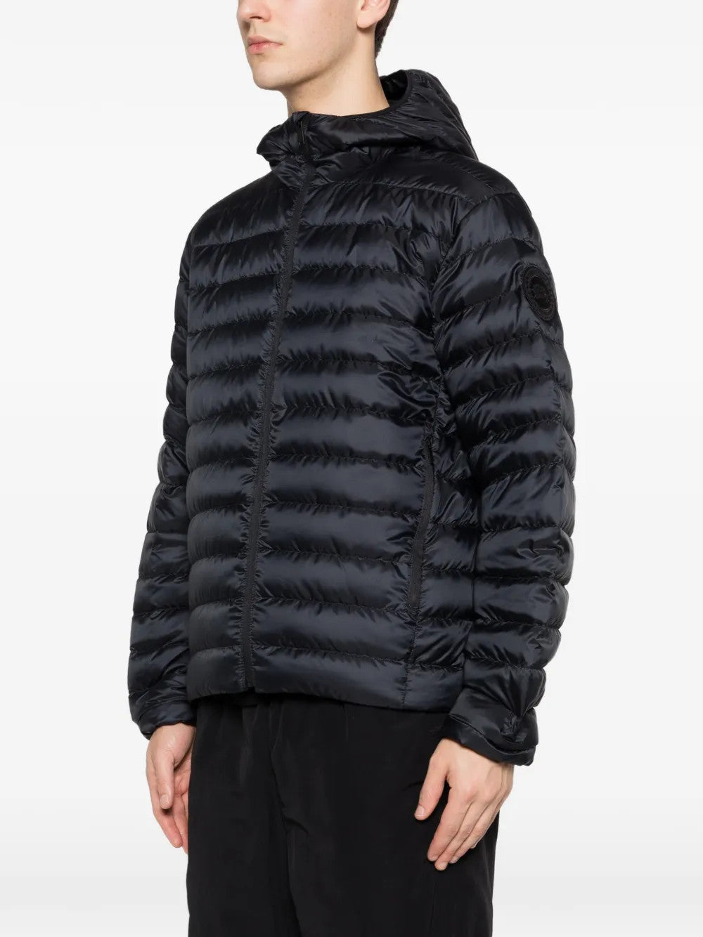 Black hoodie worn by a person, showing the hoodie fit