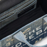 Close up of blue bag, showing texture of the cotton fabric