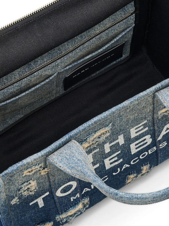 Close up of blue bag, showing texture of the cotton fabric