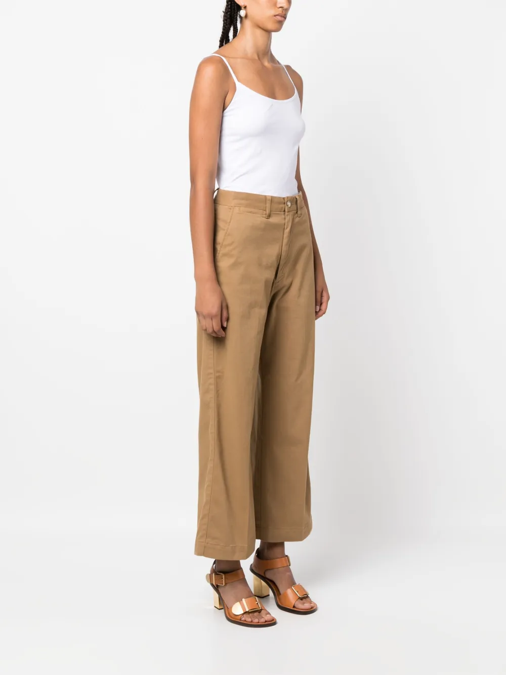 Brown pant worn by a person, showing the pant's fit