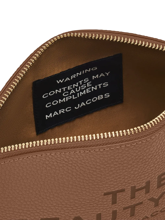 Close up of brown bags, showing texture of the Split Cow Leather and Polyurethane Coating fabric