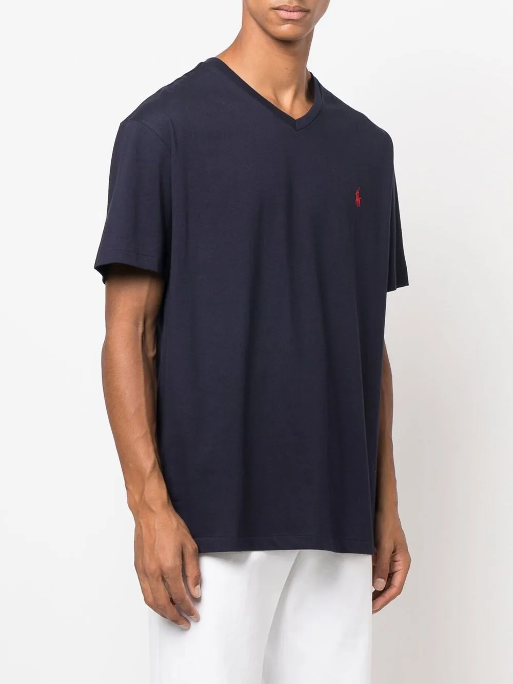 Navy shirt worn by a person,showing the shirt's fit