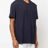 Navy shirt worn by a person,showing the shirt's fit