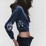 green hoodie,worn by a person,showing the hoodie fit