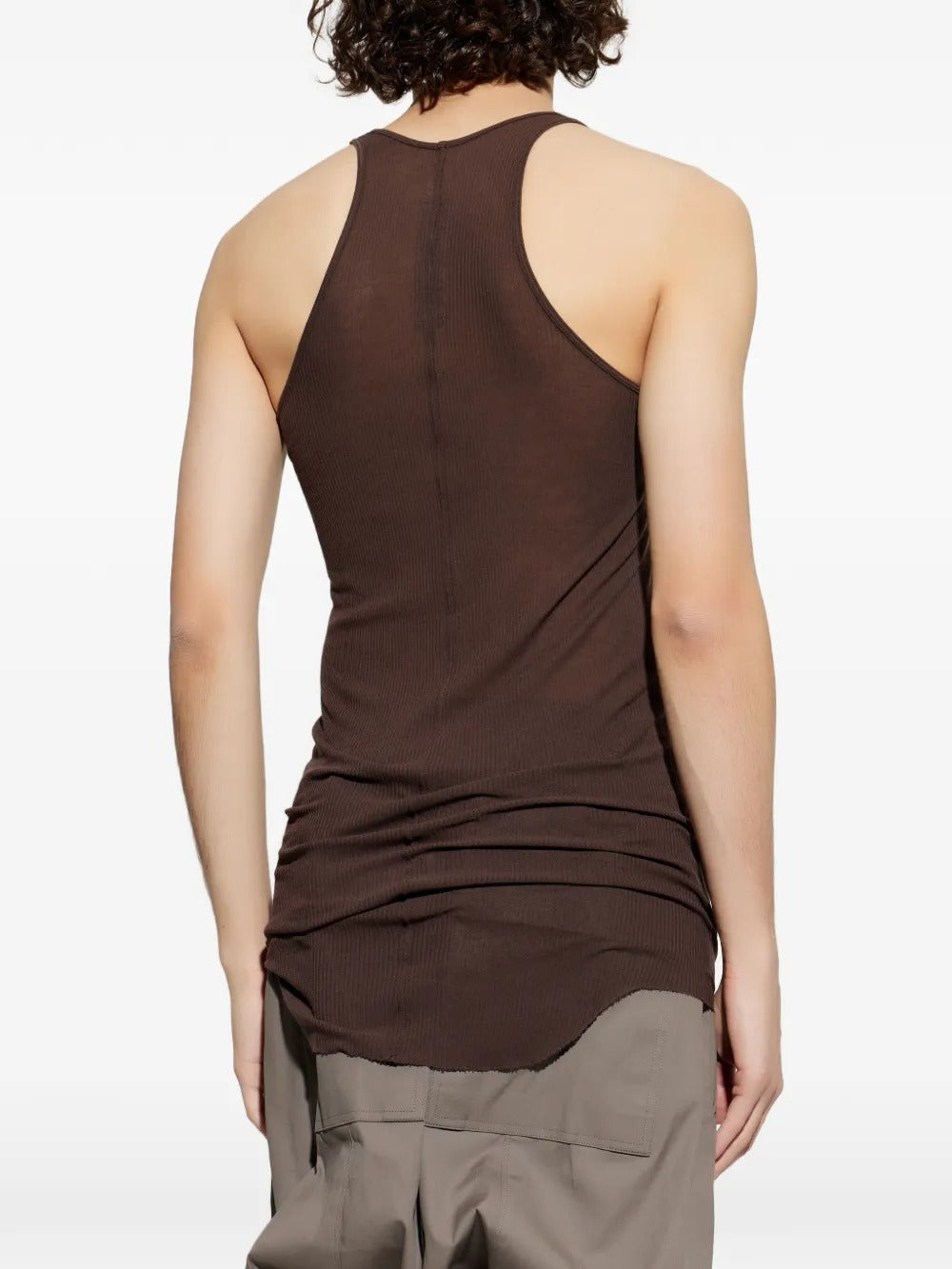 Brown tops worn by a person, showing the tops fit