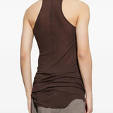 Brown tops worn by a person, showing the tops fit