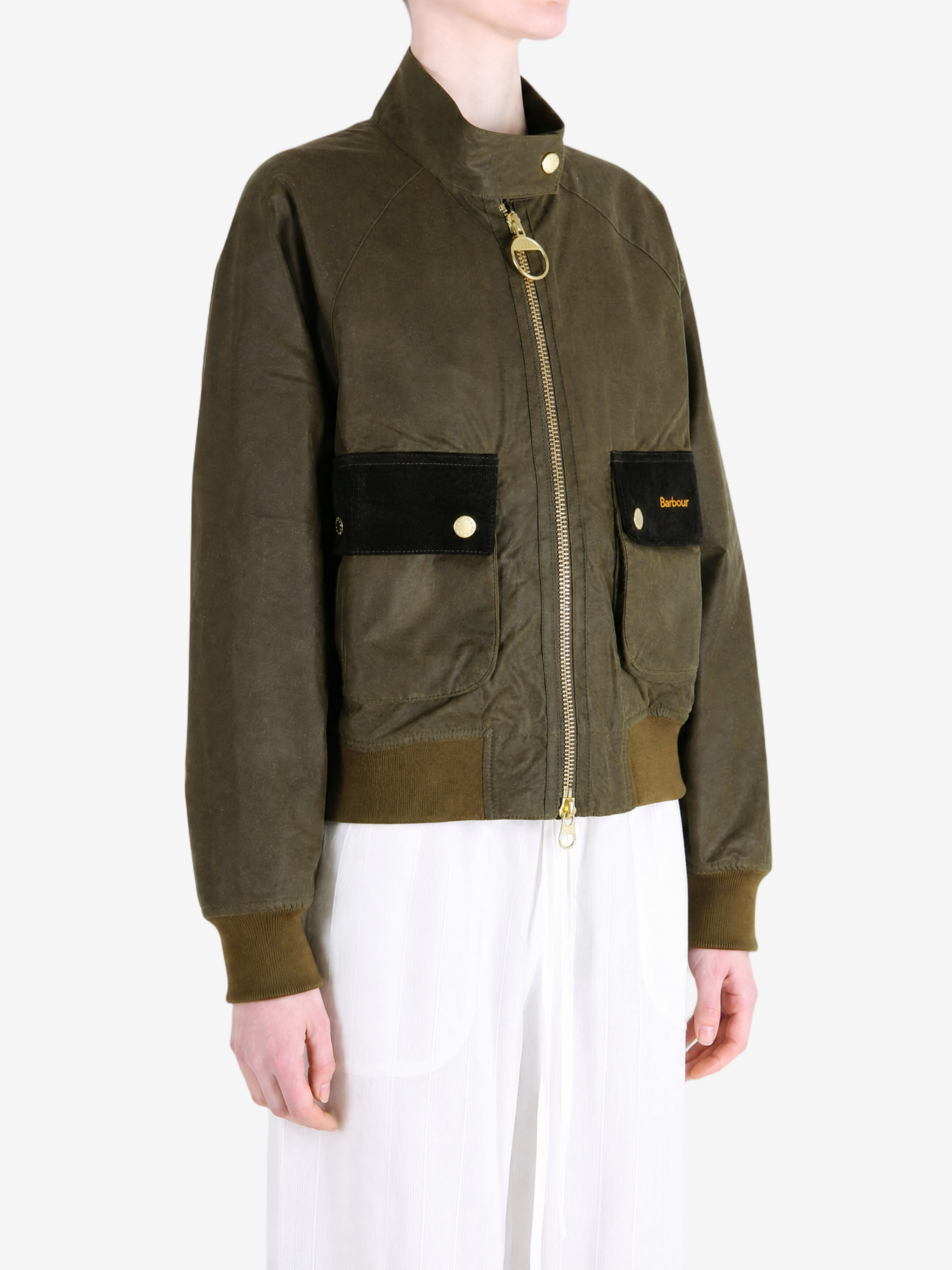 Green jacket worn by a person, showing the jacket fit