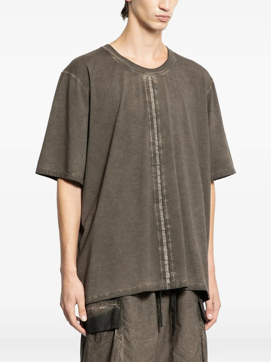 Grey t-shirts worn by a person, showing the t-shirts fit