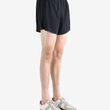 Black shorts worn by a person, showing the shorts' fit