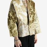 Tan jacket worn by a person, showing the jacket fit