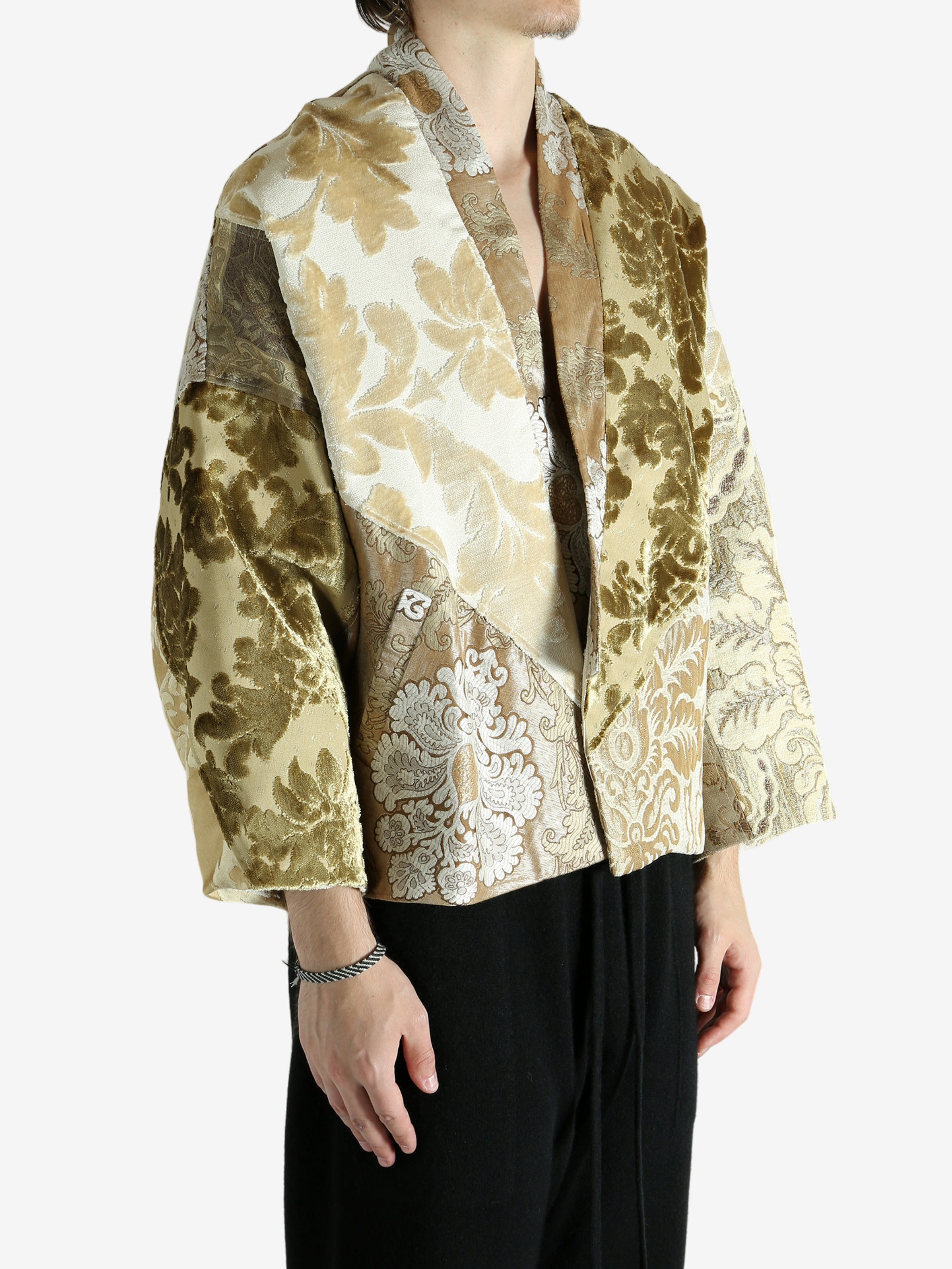 Tan jacket worn by a person, showing the jacket fit