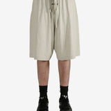 Grey shorts worn by a person, showing the shorts fit