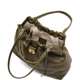 Close up of the green bag, showing texture of the leather fabric