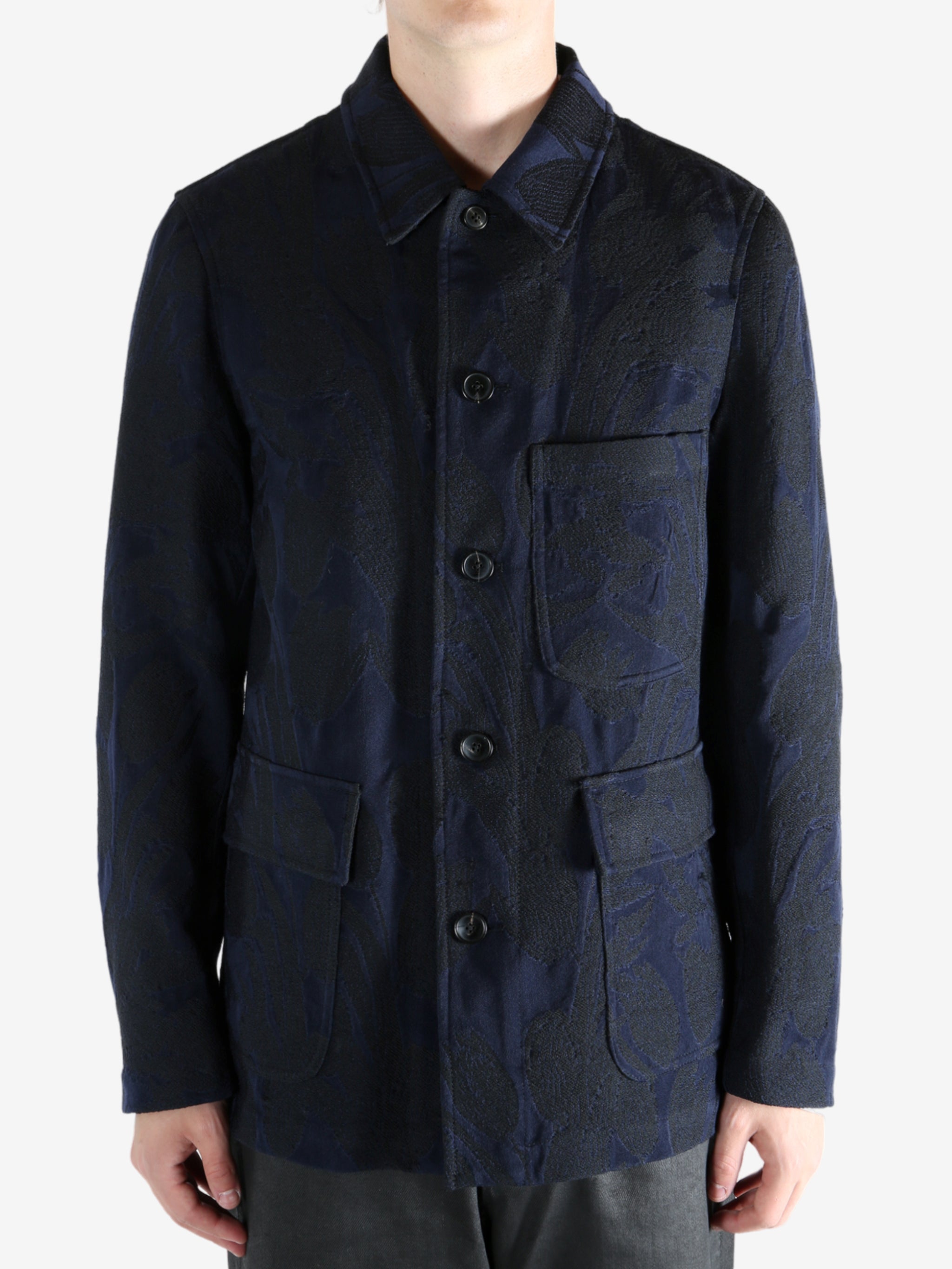 Navy jacket worn by a person, showing the jacket's fit