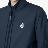 close up of black jackets-coats , showing texture of the polyester fabric