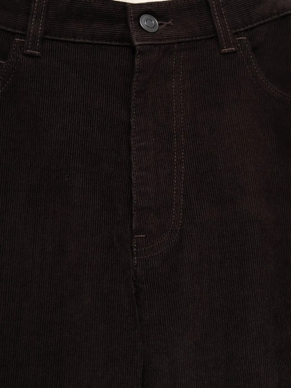 Close up of the brown pants, showing texture of the cotton fabric