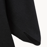 Close up of Black jacket, showing texture of the 100% wool fabric