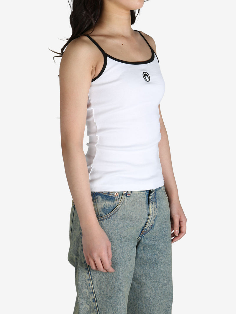 White top worn by a person, side view