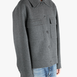 Grey jacket worn by a person, showing the pants fit